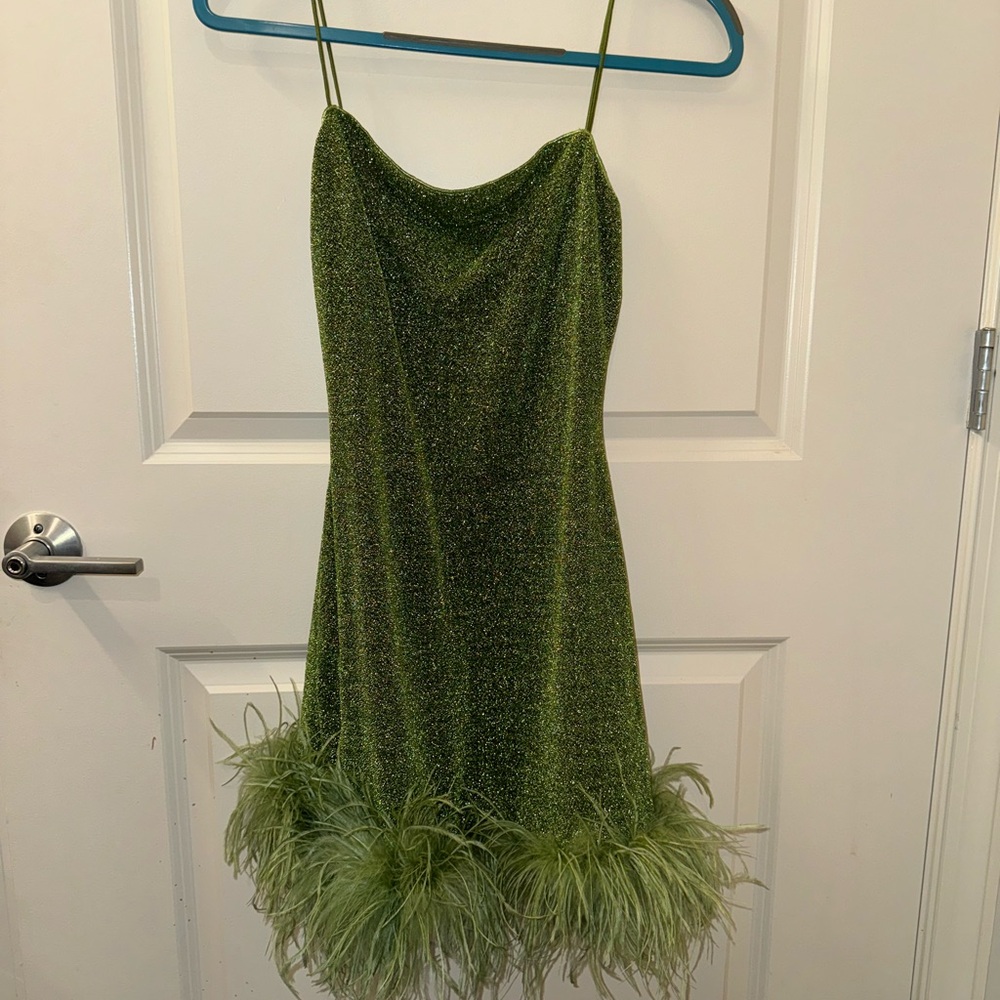 Short, sparkly mini dress. About 30 inches shoulder to hem. Tags on it.
